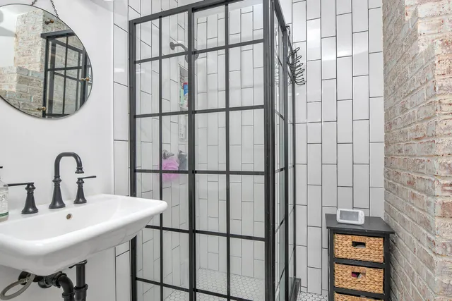 a bathroom with a sink and mirror