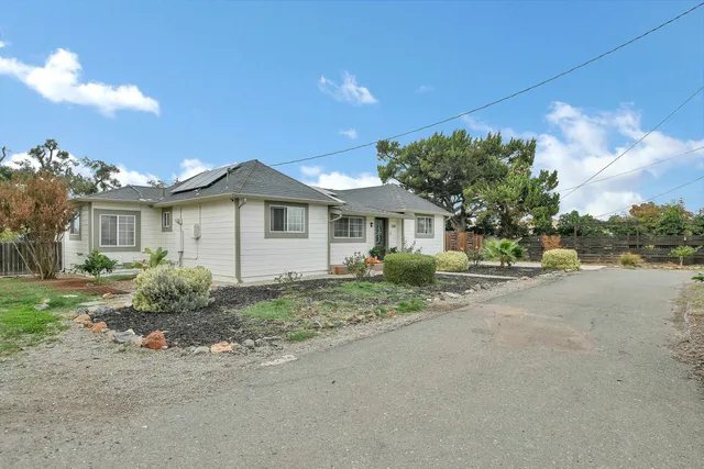 a view of a house with a street
