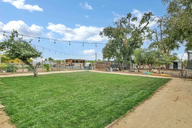 a view of a garden with a building in the background