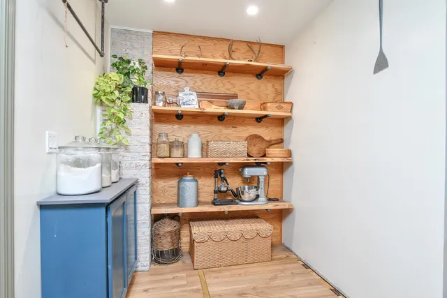 a room with storage and utility racks