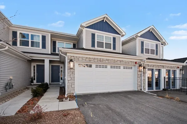 a view of a white house with large windows