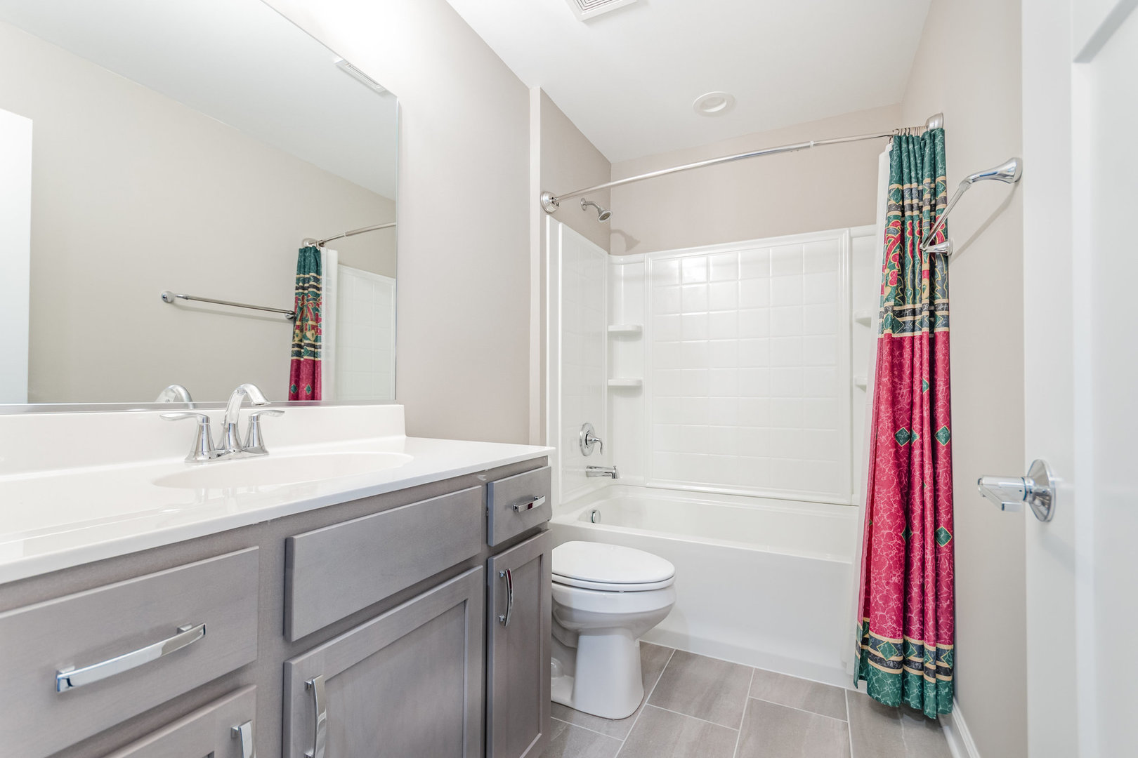 253 Masters Drive Addison, IL 60101 - Photo 12 of 15 a bathroom with a sink toilet vanity and shower