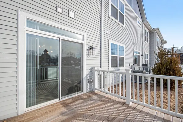 a view of a brick house with a large window