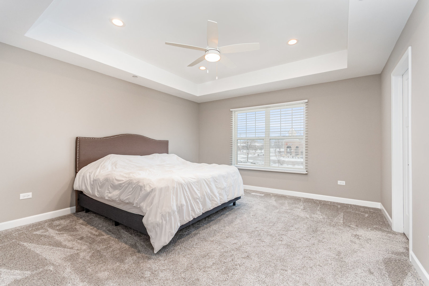 253 Masters Drive Addison, IL 60101 - Photo 8 of 15 a spacious bedroom with a bed and a window