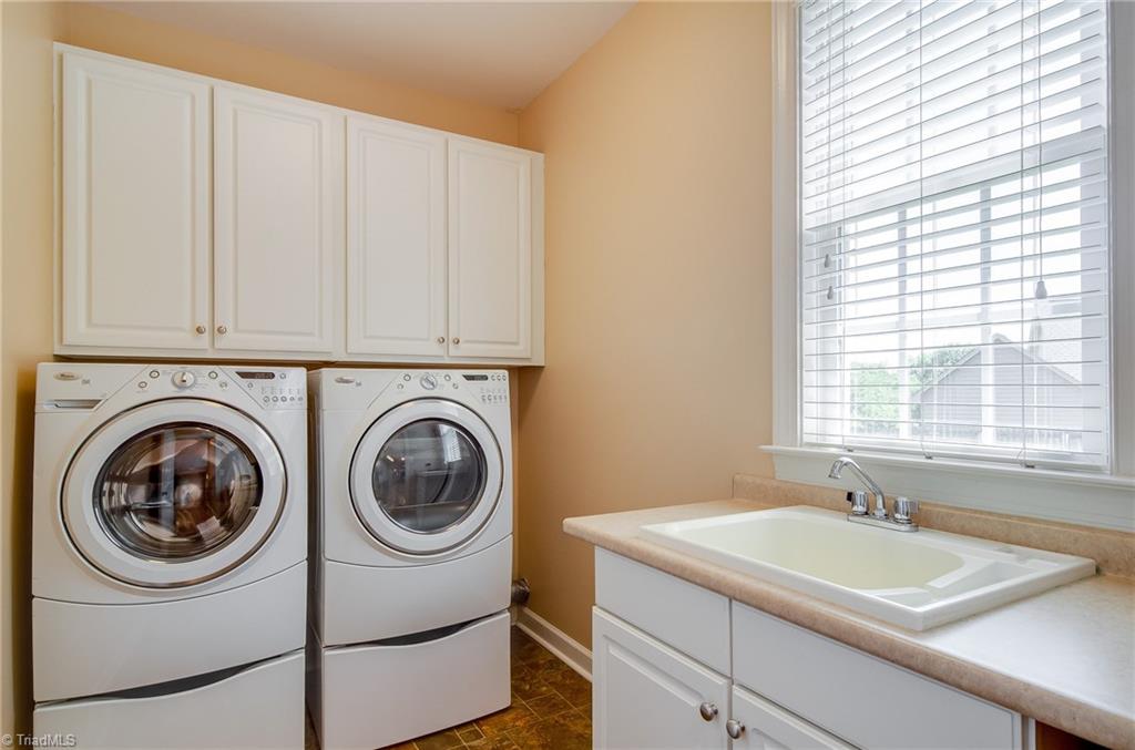 3940 Johnson Street High Point, NC 27265 - Photo 18 of 30 Now this is a laundry room! Conveniently located off of the garage, the laundry room features utility sink and cabinets plus a window to brighten up chores!