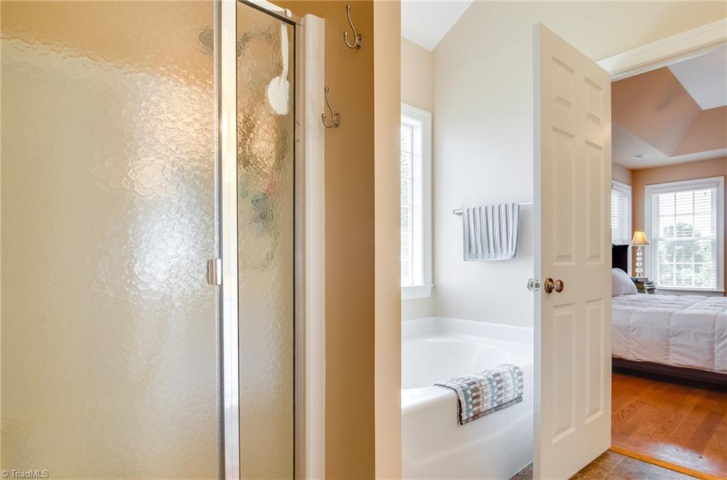 3940 Johnson Street High Point, NC 27265 - Photo 21 of 30 En-suite master bath features garden tub and separate walk-in shower.