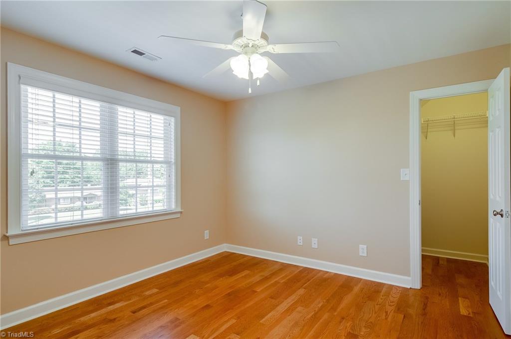 3940 Johnson Street High Point, NC 27265 - Photo 25 of 30 Third bedroom features hardwood floors, large window, and large walk-in closet! All of the bedrooms are well sized.