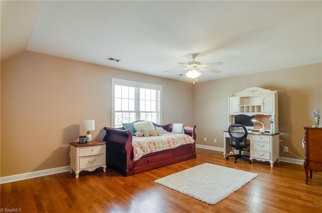 3940 Johnson Street High Point, NC 27265 - Photo 27 of 30 Bonus room is huge and features hardwood floors, ceiling fan, and eave storage. Make this a 5th bedroom, play room, office, guest room -- there are so many options with this home!
