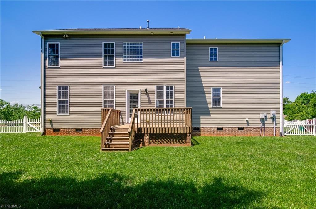 3940 Johnson Street High Point, NC 27265 - Photo 29 of 30 Additional view of back of home. The deck is in great condition and large enough for you to add your grill and deck furniture. Enjoy your morning cup of coffee and watch the sunrise!