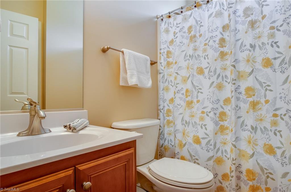 3940 Johnson Street High Point, NC 27265 - Photo 8 of 30 Full bathroom on the main level with tub/shower combo and linen closet.