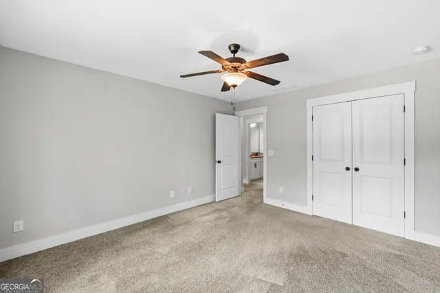a view of a hallway with a window