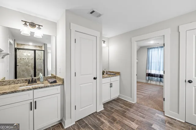 a bathroom with a tub and a shower