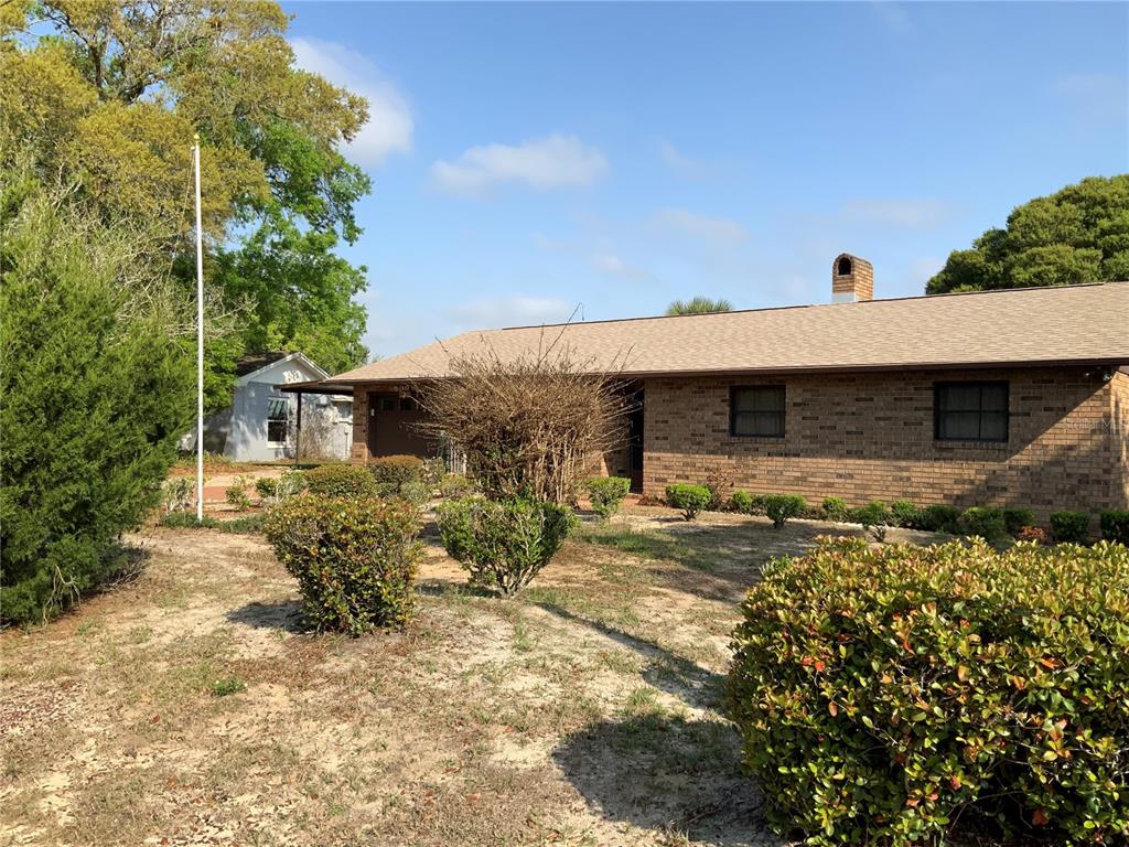 1922 Cornelia Drive Eustis, FL 32726 - Photo 1 of 1 front view of a house with a yard