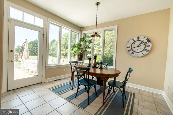 a bedroom with a bed and a flat tv screen on dresser