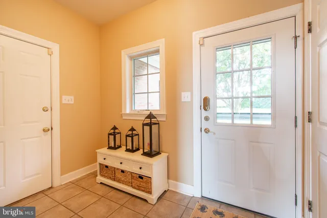 a bathroom with a double vanity sink mirror and shower