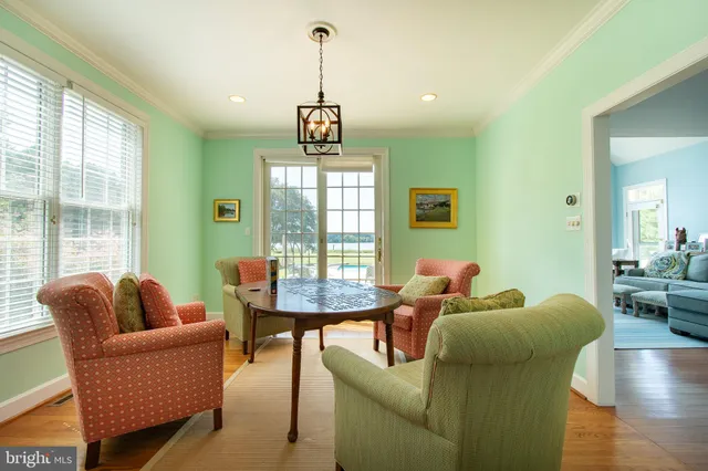 a bedroom with bed couch and window