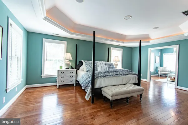 a bathroom with a sink a toilet and a window