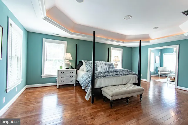 a bathroom with a sink a toilet and a window