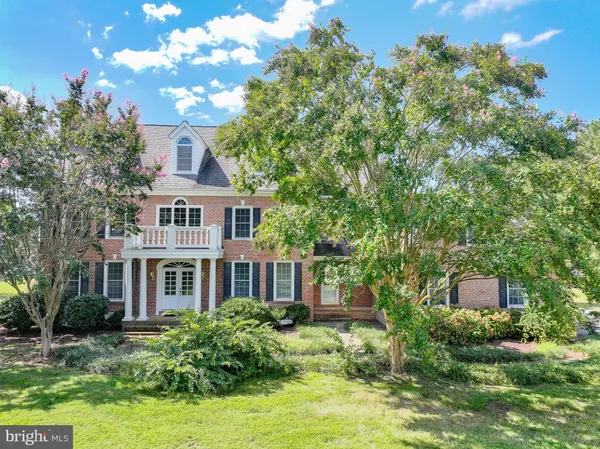 an aerial view of a house with a lake view
