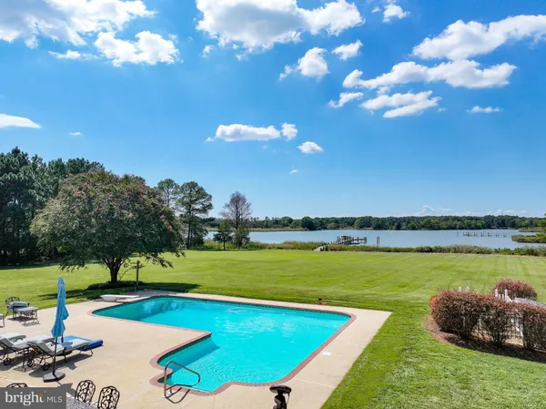 a view of an entryway with wooden floor and door
