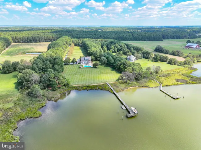 a living room with furniture flat screen tv and a fireplace