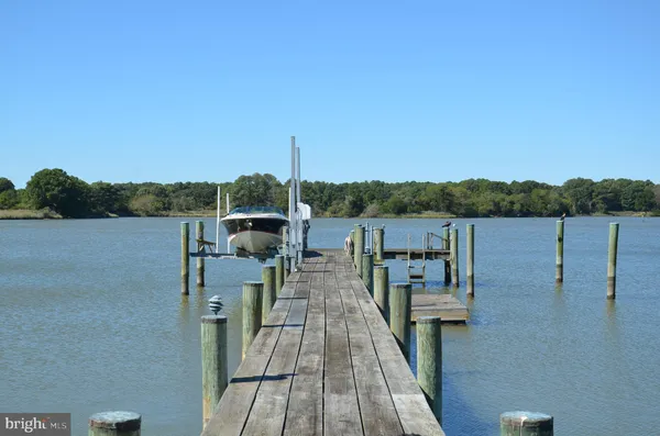 a large kitchen with granite countertop a stove a sink and a granite counter tops
