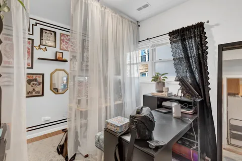 a view of workspace with wooden floor shelves