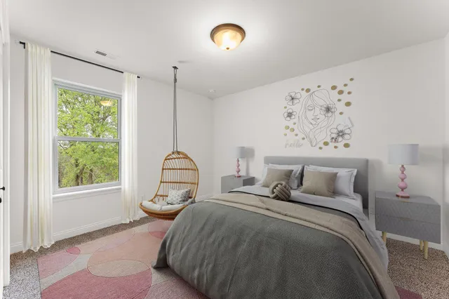 a bedroom with bed and a window