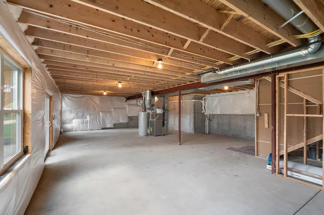 a view of empty room with wooden ceiling