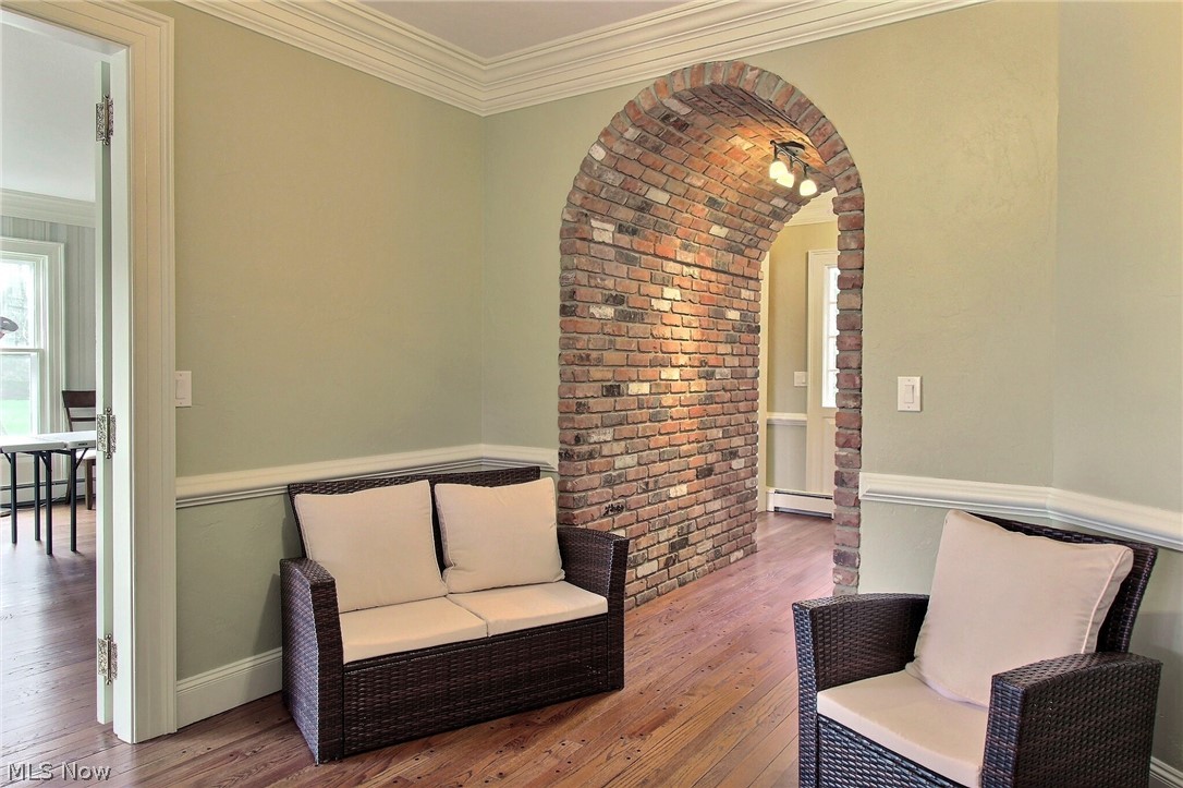 6715 Eagle Road Willoughby, OH 44094 - Photo 8 of 22 Sitting room featuring crown molding, dark hardwood floors