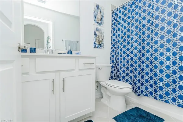 a view of a hallway with furniture and closet