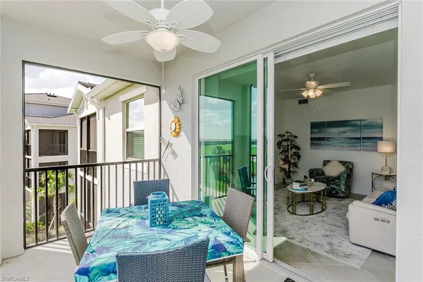 a view of a livingroom with furniture and a potted plant