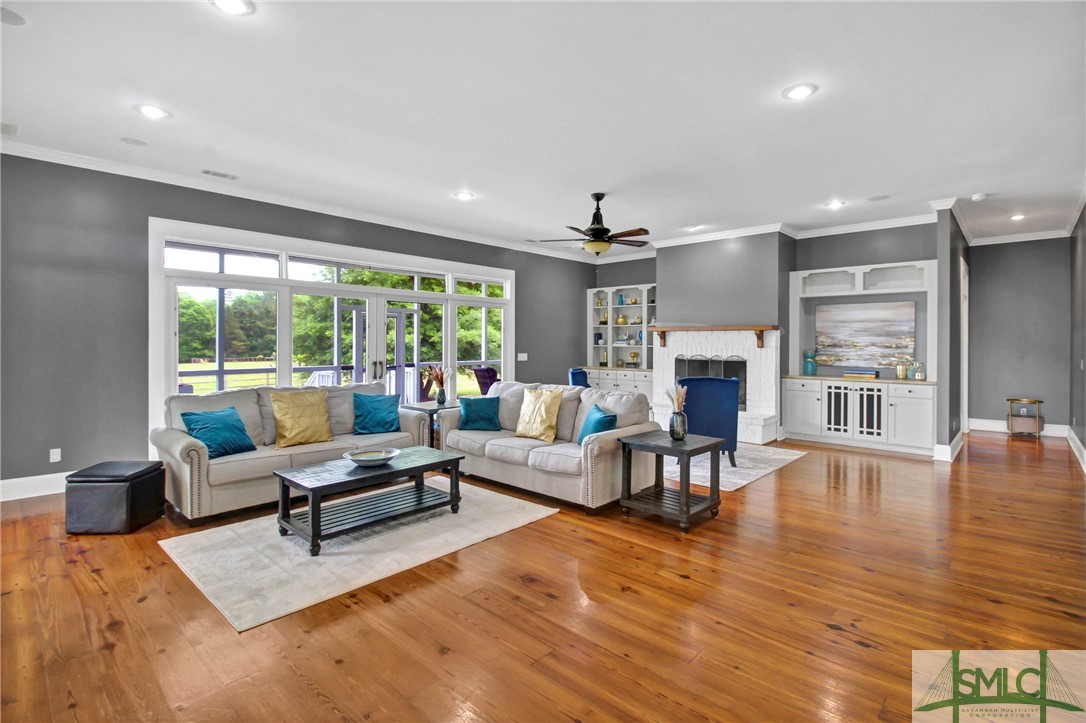 1600 Arcola Road Pembroke, GA 31321 - Photo 23 of 50 The expansive living look with fireplace & built-i