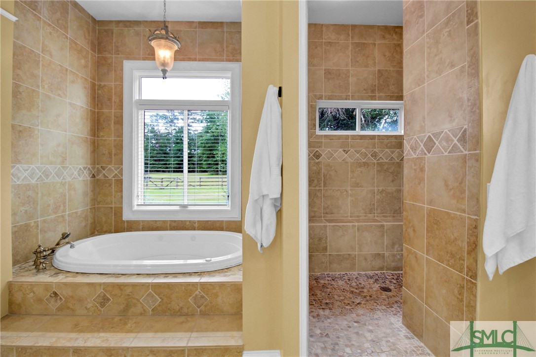 1600 Arcola Road Pembroke, GA 31321 - Photo 28 of 50 Ensuite walk-in shower with dual showerheads & jet