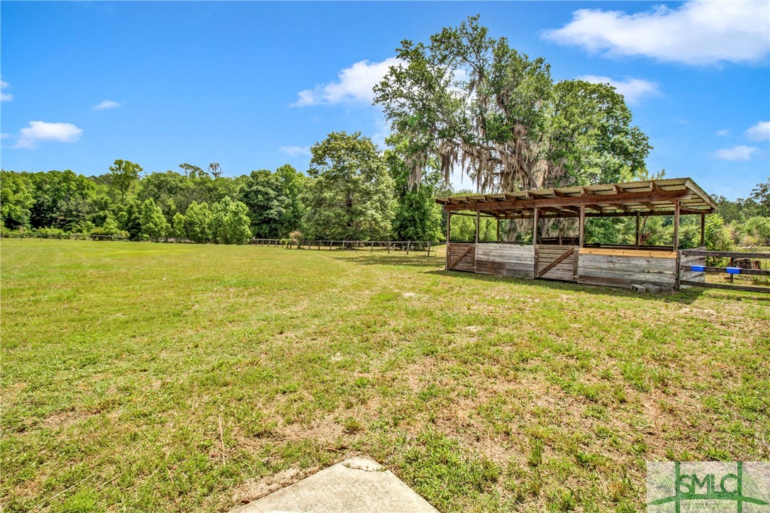 1600 Arcola Road Pembroke, GA 31321 - Photo 45 of 50 Outdoor horse stalls and views of one of the pastu