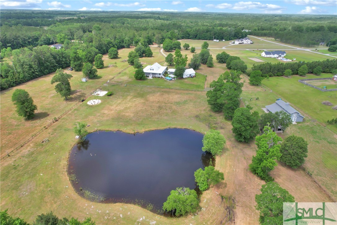 1600 Arcola Road Pembroke, GA 31321 - Photo 49 of 50 Rear aerial view of property with pond & 3 pasture