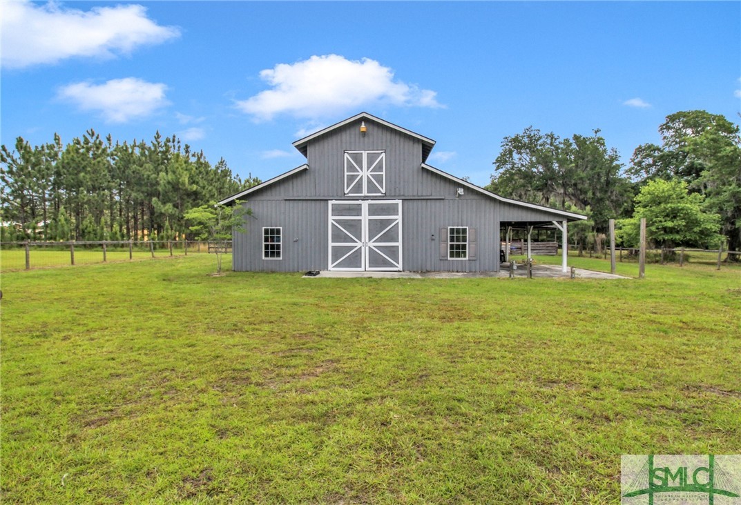 1600 Arcola Road Pembroke, GA 31321 - Photo 7 of 50 The 6 stall horse barn features an office space, b