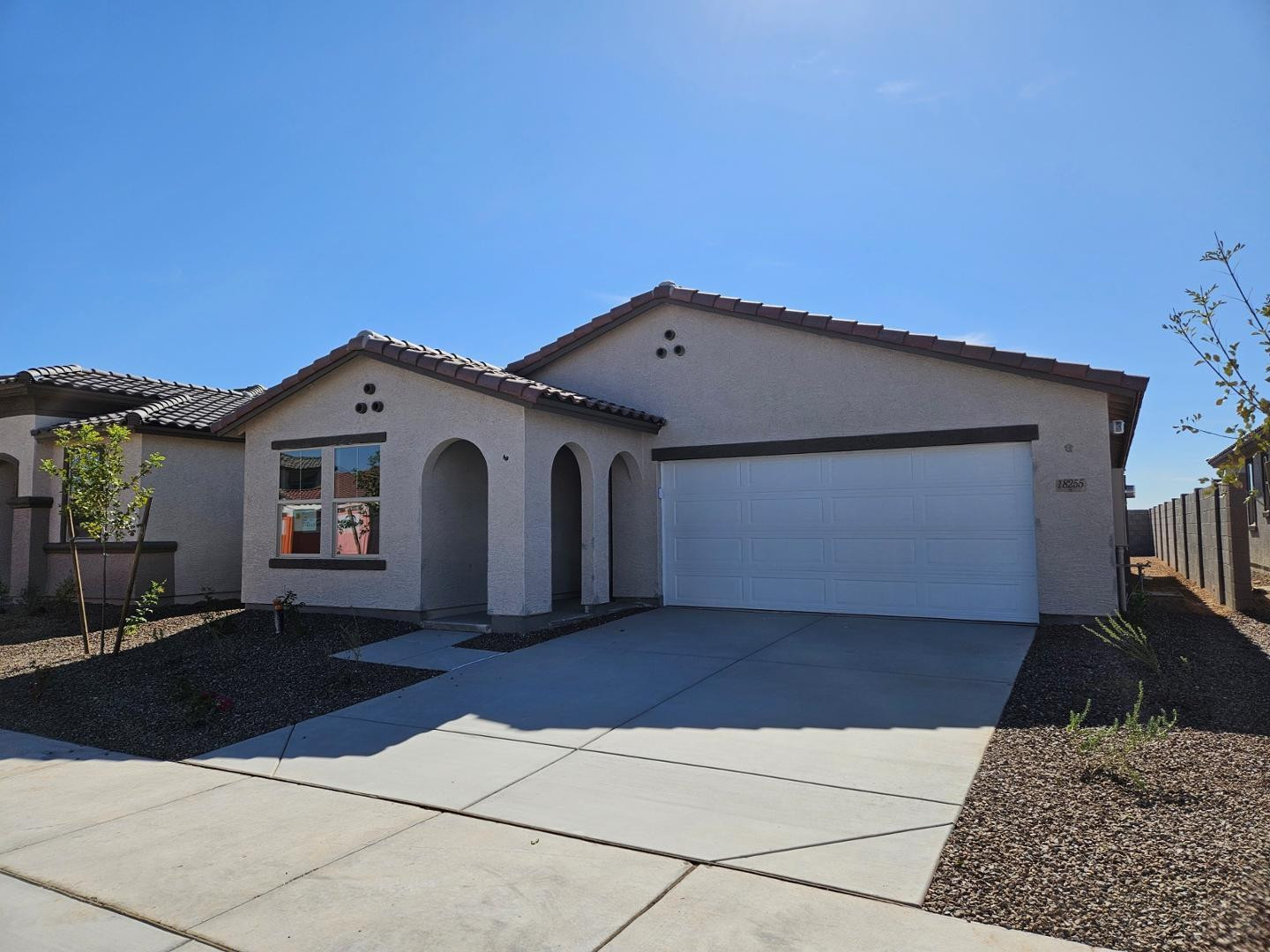 18255 West Pima Street Goodyear, AZ 85338 - Photo 1 of 12 a front view of a house with a yard