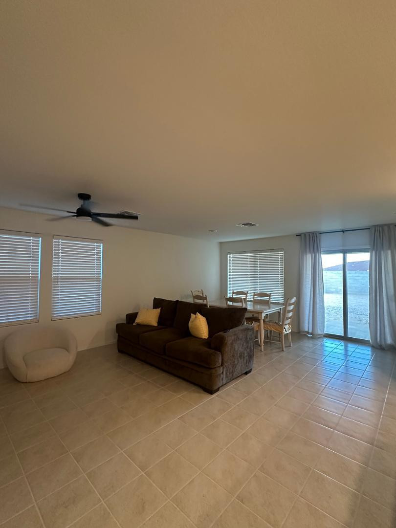 18255 West Pima Street Goodyear, AZ 85338 - Photo 5 of 12 a living room with furniture and a window