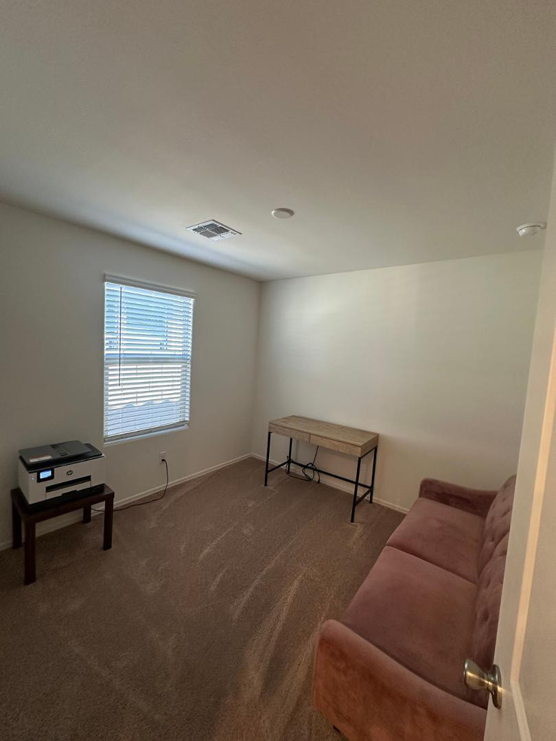 18255 West Pima Street Goodyear, AZ 85338 - Photo 6 of 12 a room with furniture and a window