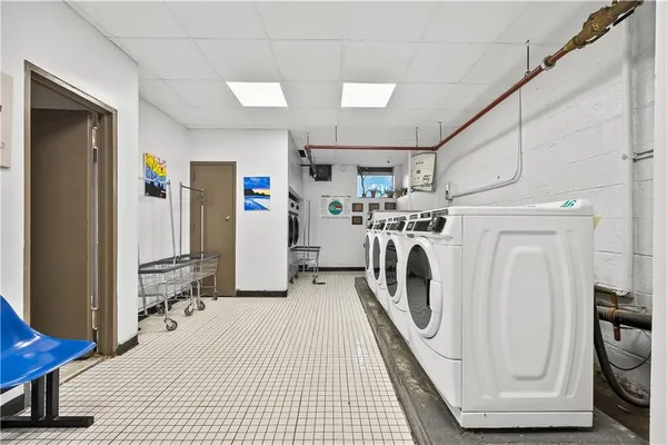 a view of a storage & utility room with washer and dryer