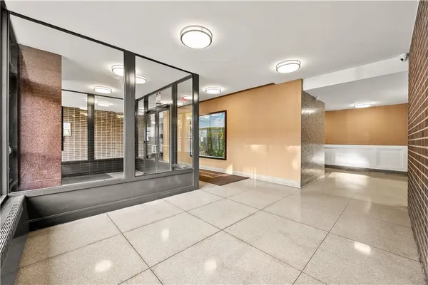a bathroom with a glass door shower