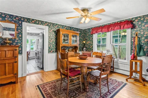 a view of a dining room with furniture window and outside view