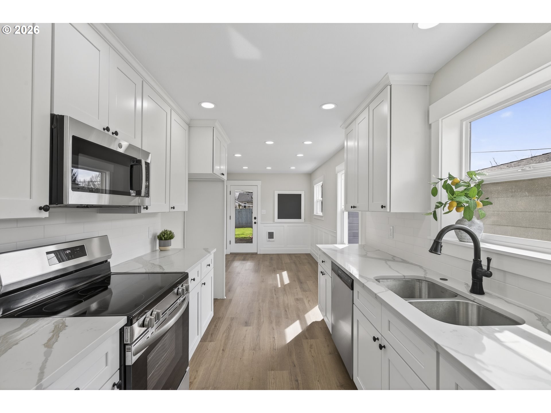 520 24th Avenue Longview, WA 98632 - Photo 13 of 37 a kitchen with a sink appliances and cabinets