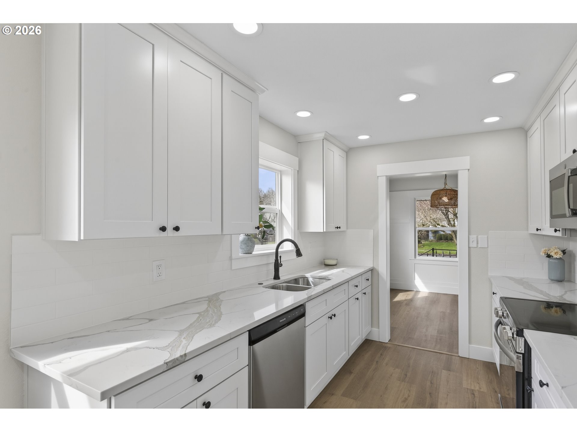 520 24th Avenue Longview, WA 98632 - Photo 15 of 37 a kitchen with a sink cabinets and window
