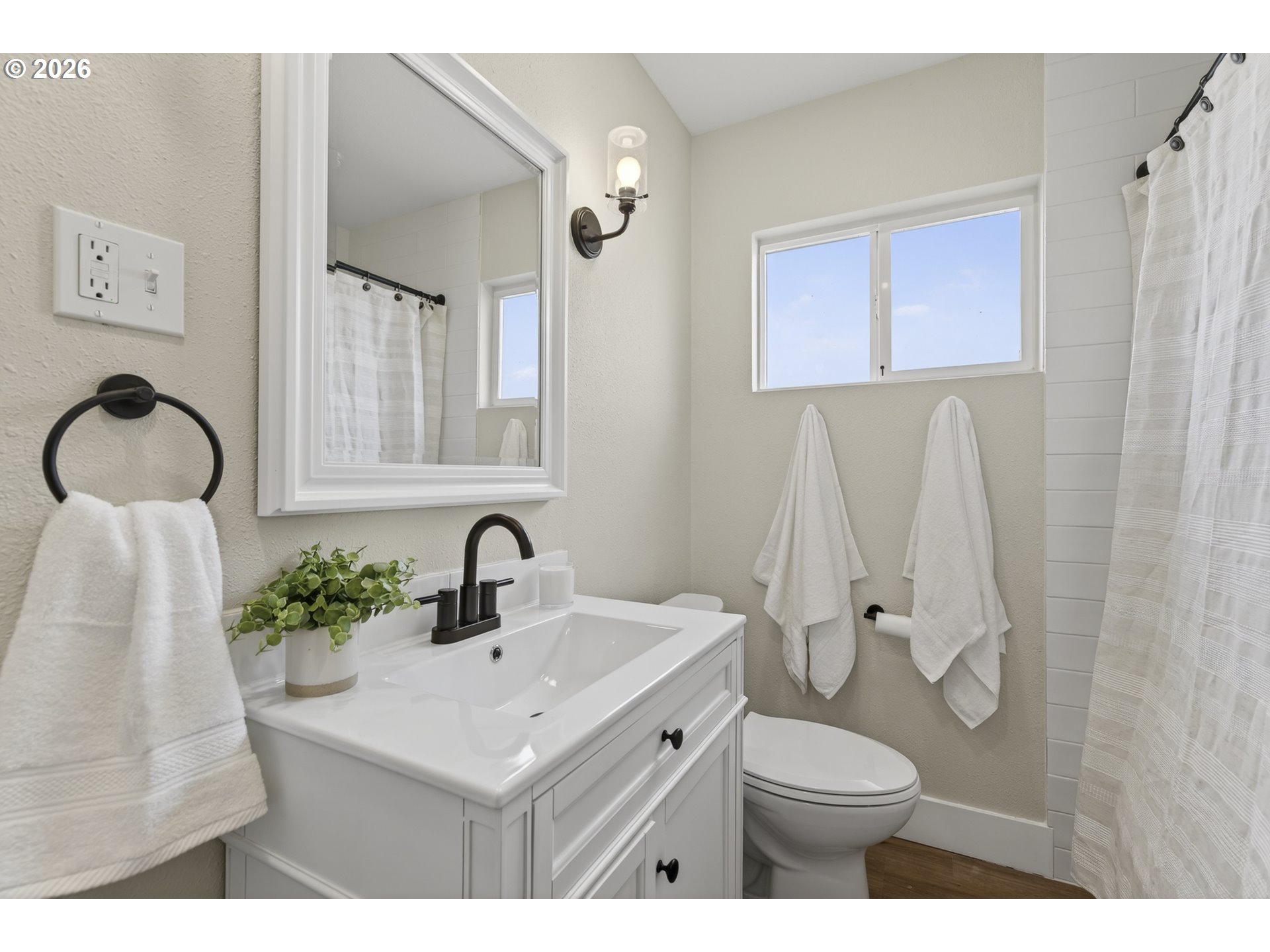 520 24th Avenue Longview, WA 98632 - Photo 19 of 37 a bathroom with a sink toilet and shower