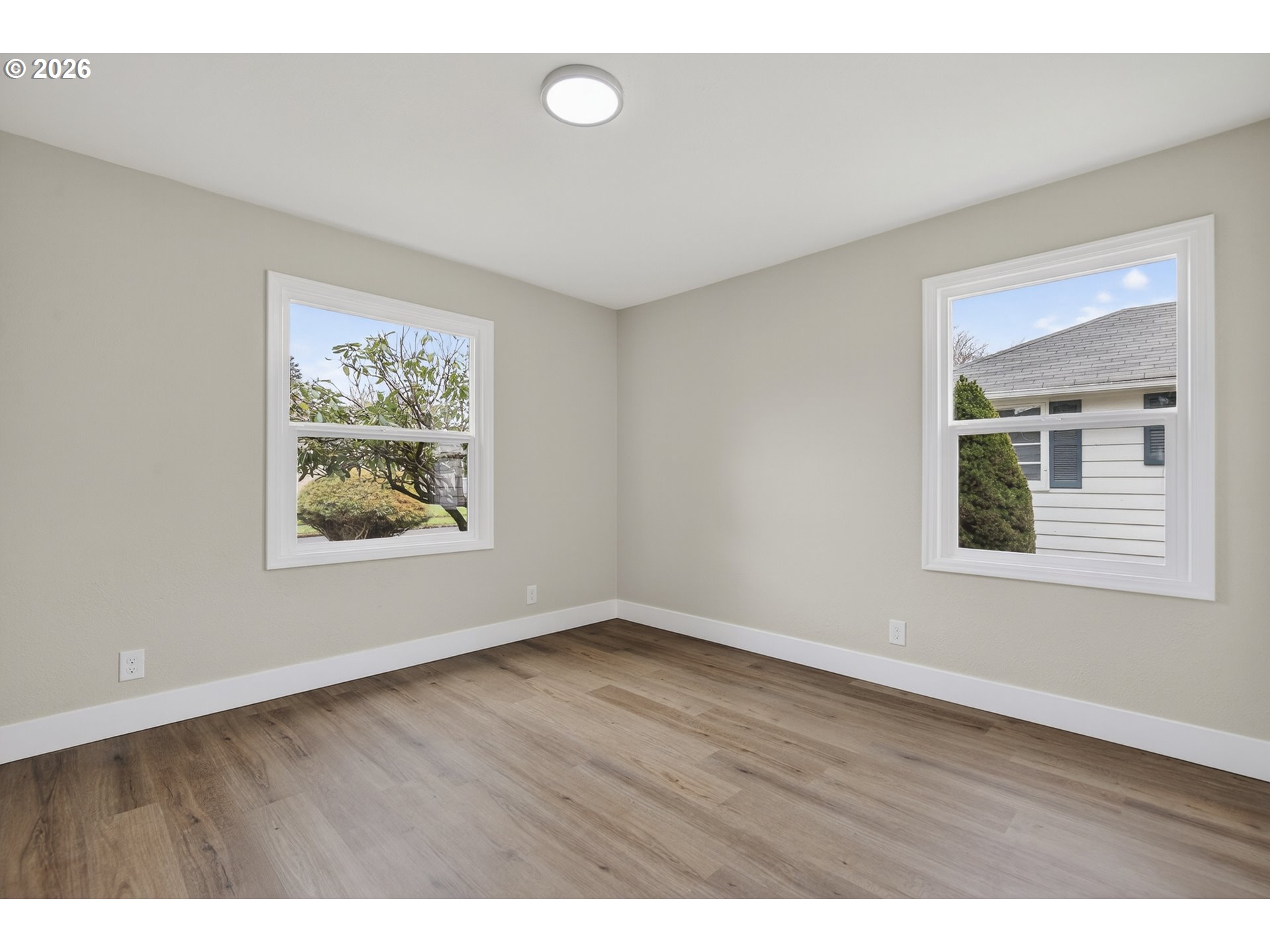520 24th Avenue Longview, WA 98632 - Photo 20 of 37 a view of an empty room with window and wooden floor