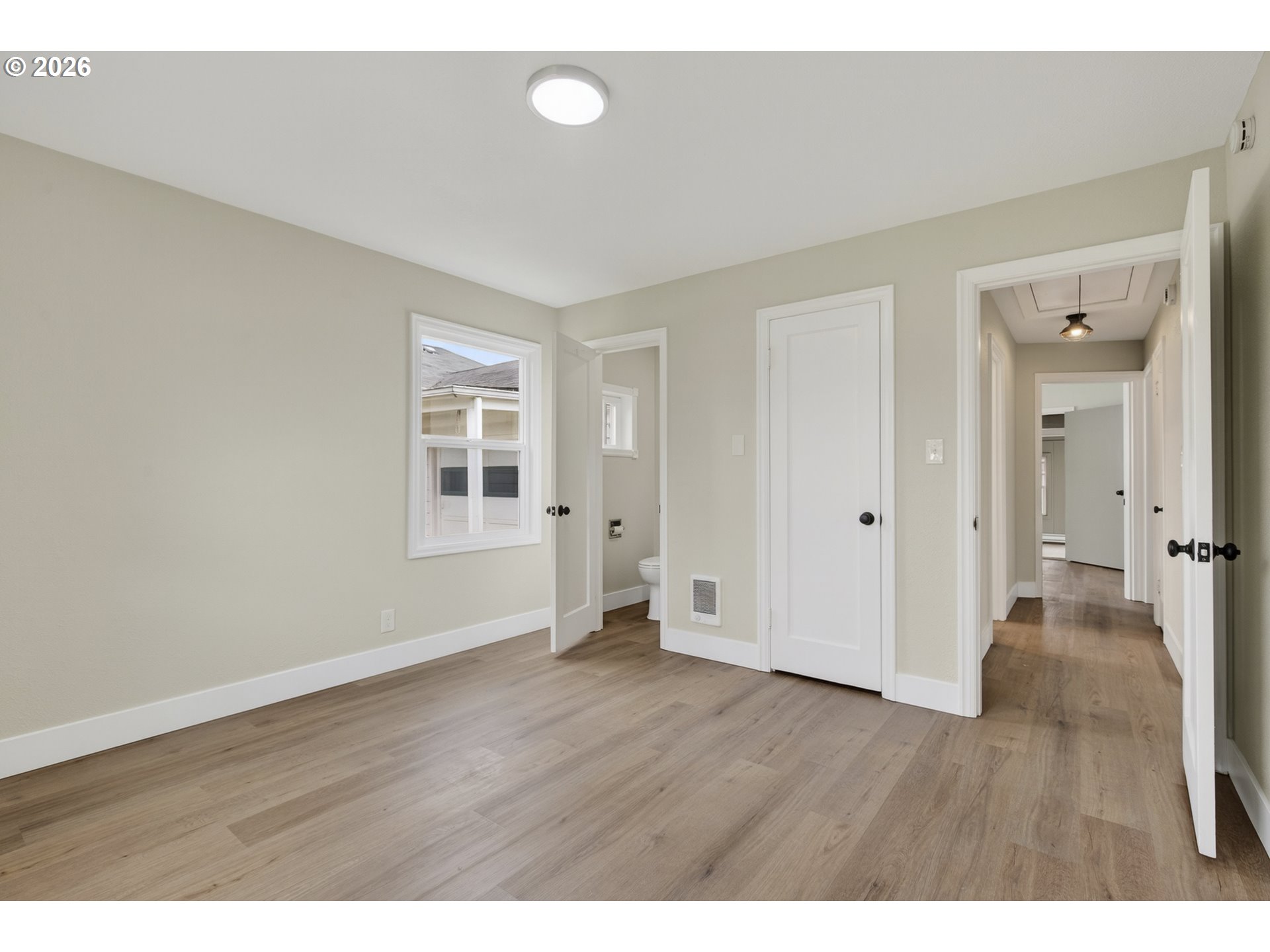 520 24th Avenue Longview, WA 98632 - Photo 21 of 37 a view of an empty room with wooden floor and a window