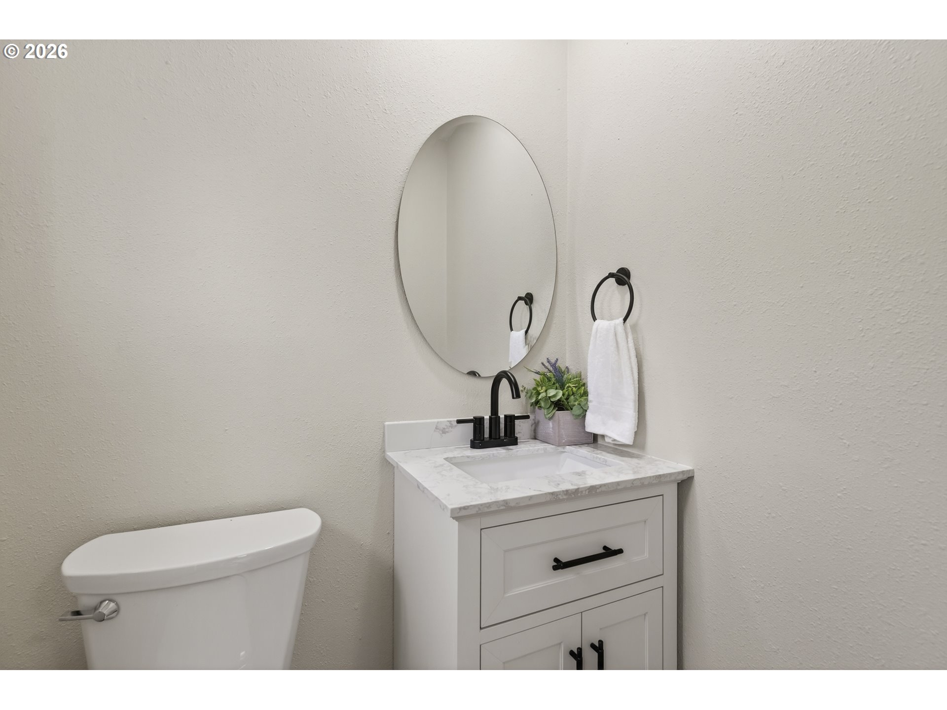 520 24th Avenue Longview, WA 98632 - Photo 22 of 37 a bathroom with a toilet sink and mirror