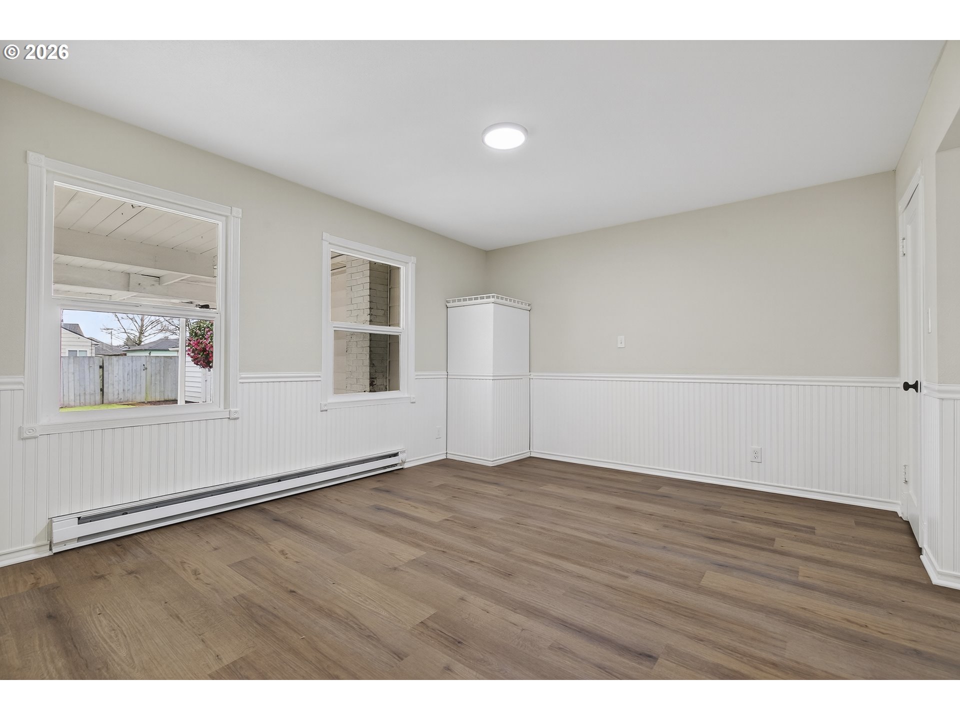 520 24th Avenue Longview, WA 98632 - Photo 23 of 37 a view of an empty room with wooden floor and a window